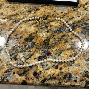 SEA MAGIC by Mikimoto. 17.5” Akoya pearl necklace with 14k gold clasp.